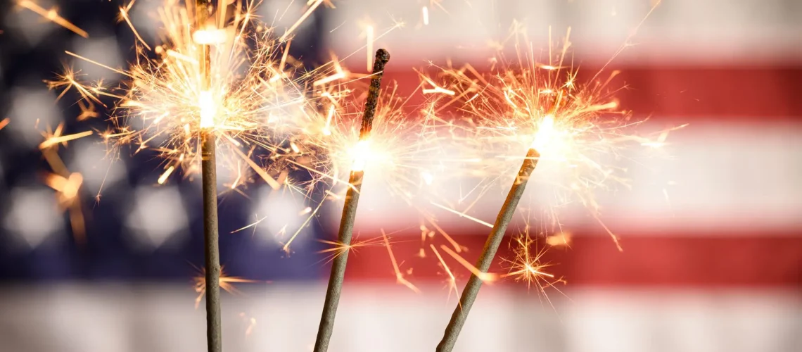 sparkler-closeup-with-american-flag-in-background-2021-08-26-15-27-44-utc-scaled-1